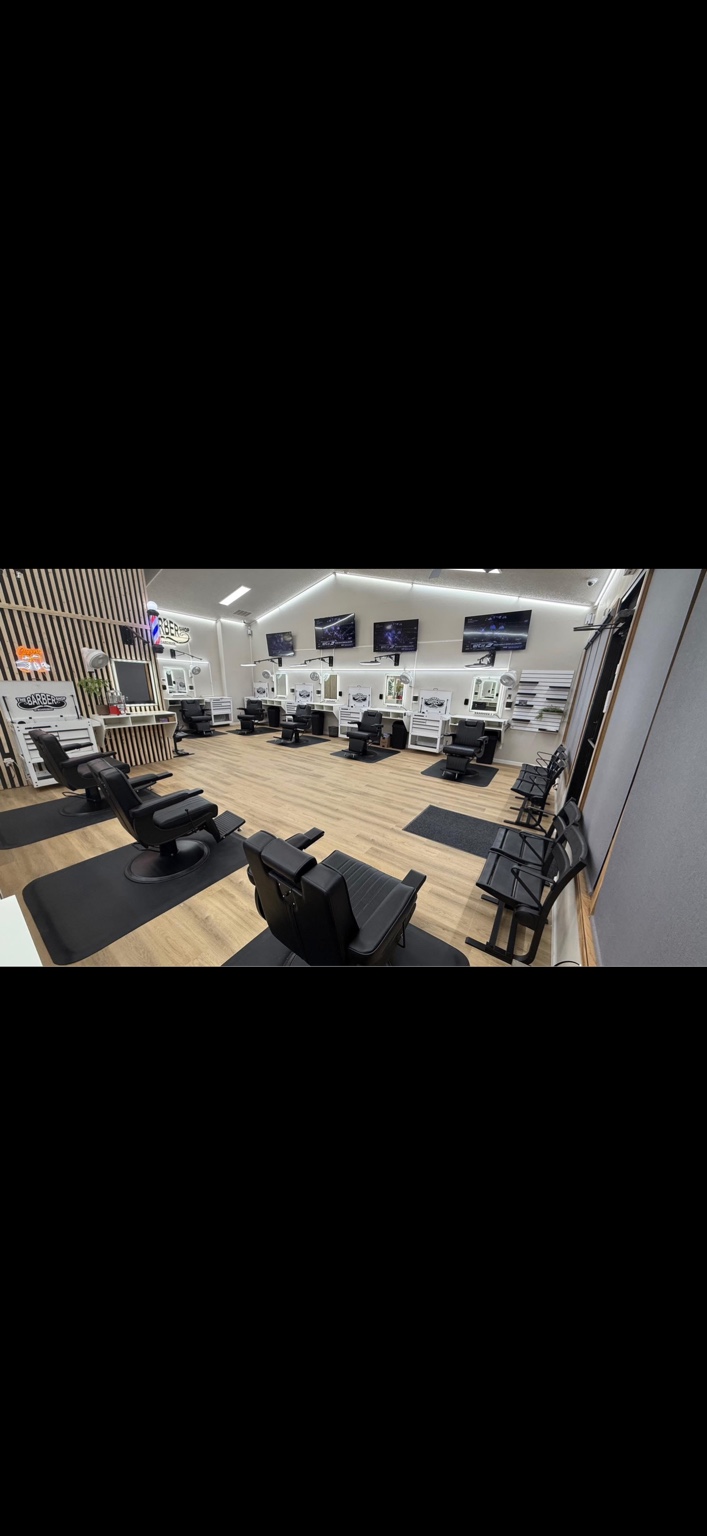 Inside The Barbershop of Boardman, showing the barber chairs and work stations
